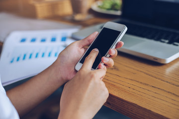 Woman use of smart phone at cafe