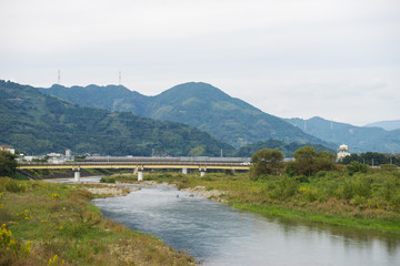 Obraz na płótnie Canvas Autumn Okitsu River and Okitsu Ohashi Bridge