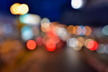 Night city street colorful lights bokeh background,  Abstract bokeh from car light on the traffic road.