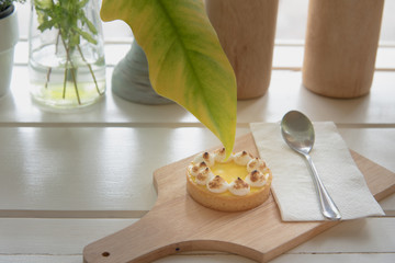 lemon tarts on wood plate