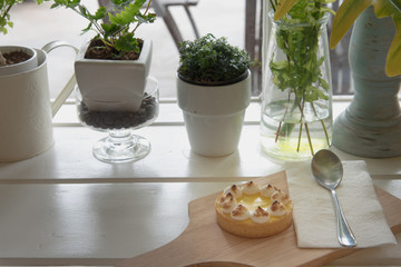 lemon tarts on wood plate