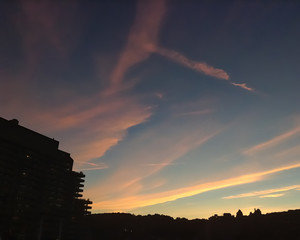 Sunset behind buildings