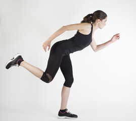 Sports woman running race female athlete runner isolated on grey