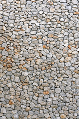 Gray and brown wall with stone masonry, background, texture