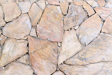 Brown wall with stone masonry, background, texture