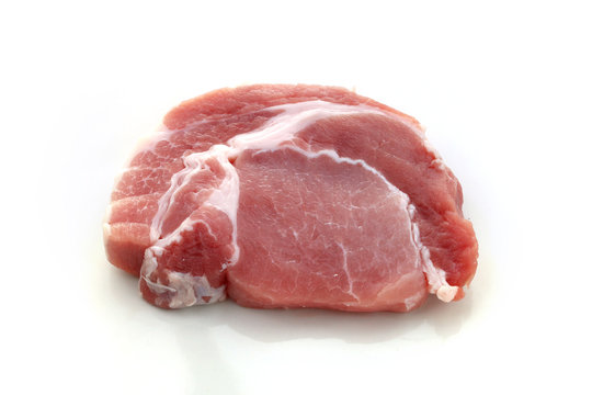 Raw meat, pork, slices pork on a white background