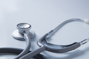 Stethoscope on blue background