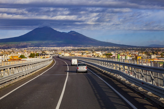 A one motorway from naple to rome passing naple town and vesuviu