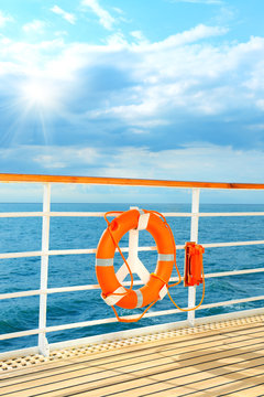 lifebuoy on a railing of cruise ship