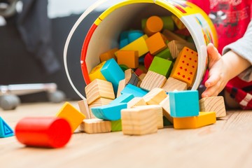 Small boy playing with wooden blocks