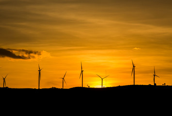 silhouette wind wheel on mountain