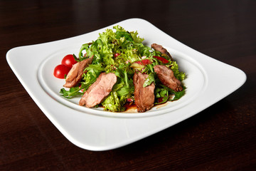 Grilled beef steak with green salad