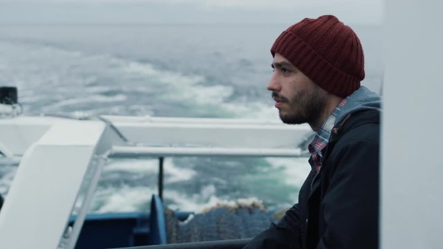 Serios Man Stands on the Ship and Looks At the Sea. Shot on RED Cinema Camera in 4K (UHD). 