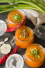 Homemade pumpkin soup on slate plate. Rustic style