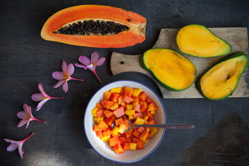 Healthy vegan breakfast of raw tropical fruits.