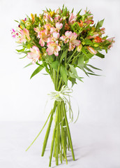 Bouquet alstroemeria on a light gray background.  Still life with colorful alstroemeria. Fresh alstroemeria.  Place for text. Flower concept. Fresh spring bouquet. Summer Background