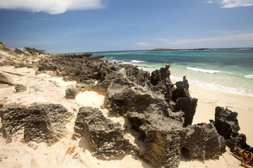 Fototapeta na wymiar Bay Amoronia Indian Ocean, Orange cove is lined with sharp rocks, north of Madagascar