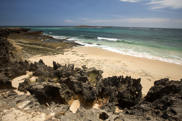 Bay Amoronia Indian Ocean, Orange cove is lined with sharp rocks, north of Madagascar