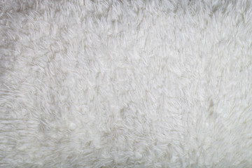 Top view on texture of white artificial fur for background