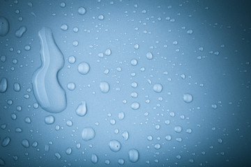 Drops of water on a color background. Toned