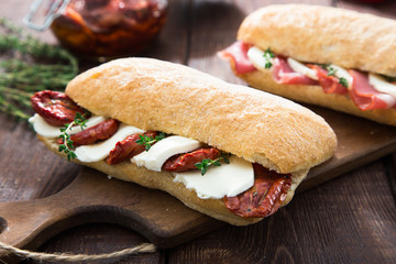 assorted sandwiches. sandwich Caprese with mozzarella and sun-dr
