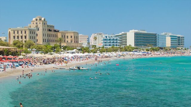 Eli Beach in Rhodes Greece with Many Tourists Enjoying the Scenic Oceanfront Resort Setting during the Mediterranean Summer Season