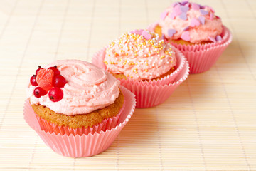vanilla cupcakes on a bamboo mat