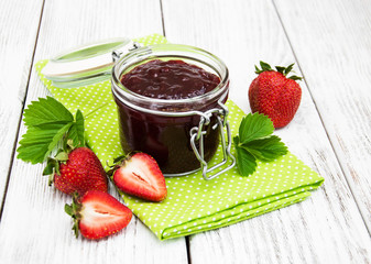 Strawberry jam and fresh strawberries