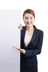 Young attractive asian woman showing a white board