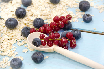 Healthy breakfast Fresh granola, muesli in bowl with milk and berries on a white background