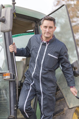 Farmer leaning on the tractor