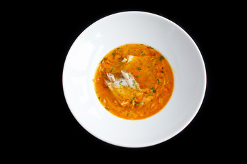 fresh cabbage soup with ribs in white plate and blacj background