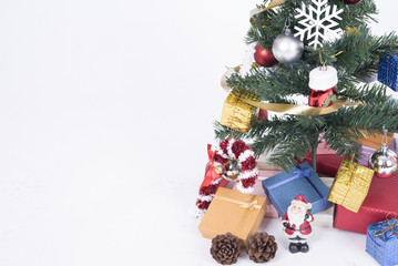 Fototapeta na wymiar Christmas decorative with gift box and snowflake on christmas tree and white background.