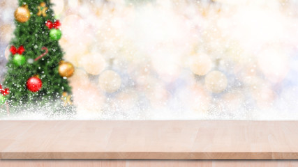 Fototapeta na wymiar Wood table top on gold bokeh christmas tree background with snowfall.