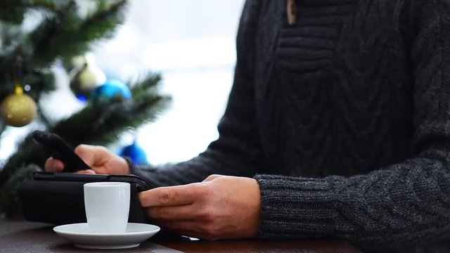 Cup with hot coffee on grey Table. I love my job concept. Christmas lights background 