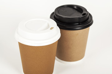 Paper cup of coffee on white background