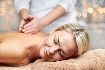 Fototapeta na wymiar close up of woman lying and having massage in spa