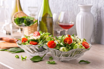 salad with tomato , arugula and spinach