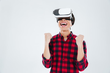 Asian man wearing virtual reality device and make winner gesture