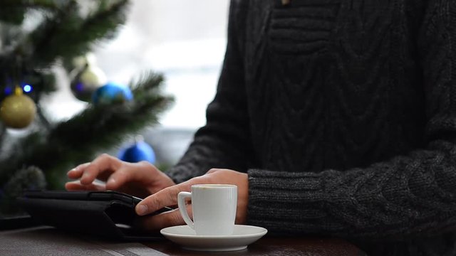 Cup with hot coffee on grey Table. I love my job concept. Christmas lights background 