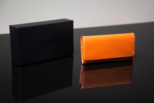 Orange leather wallet and box