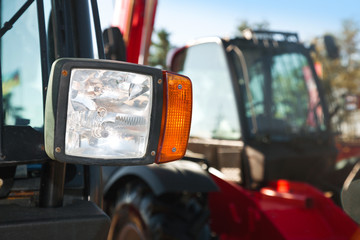 Tractor headlight, huge machine with light equipment. © murika