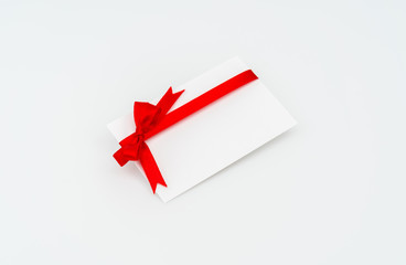 Card with red ribbons bows .