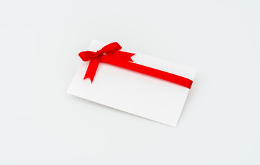Card with red ribbons bows .