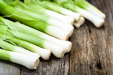 Fresh leeks, green vegetables, farm fresh produce on farmer table