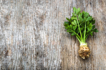 Root of celery with leaves, green vegetables, local market produce