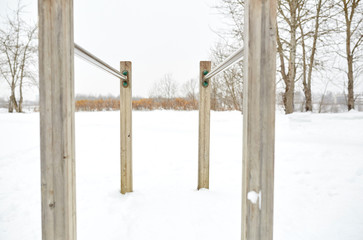 parallel bars outdoors in winter