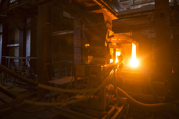 large melting furnace.Glass recycling. Bottle manufacturing industrial factory. Molten
