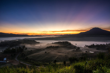 mist over the valley of mountain at sun rising giving a beautiful 