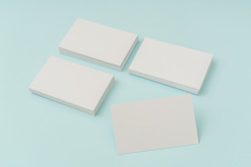 Blank business card on blue background .